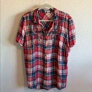 Button down short sleeve collard blouse.